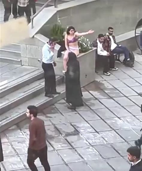 clothes torn off|Iranian woman detained after taking clothes off at。